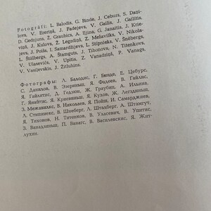May include: A list of names in both English and Latvian, likely a list of photographers. The list is printed in black ink on a white background.