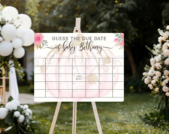 May include: Pink and gold baby shower game sign with a pumpkin design and the text "Guess the due date of baby Bethany". The sign has a calendar with dates and a space for guests to write their guesses.
