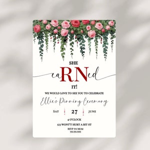 May include: A white invitation with pink roses and green vines at the top. The text reads "SHE earned RN IT!" and "Ellie's Pinning Ceremony" with the date "SAT 27 JUNE" and time "4 O'CLOCK". The address is "123 WONT'T HURT A BIT ST" and the RSVP information is "RSVP TO MOM 555-555-5555".