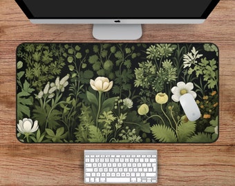 Puede incluir: Un tapete de ratón negro y verde con un diseño floral, flores blancas y hojas verdes.