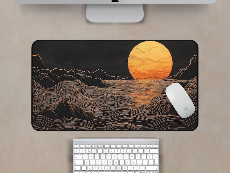 May include: A black and gold mouse pad with a stylized illustration of a sun setting over a wavy ocean. The sun is a bright orange and yellow color, and the waves are a light gold color.
