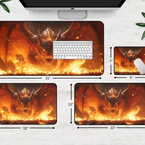 May include: A set of four mouse pads featuring a fiery dragon design. The largest mouse pad is 31 inches by 15.5 inches, the next largest is 22 inches by 12 inches, and the two smallest are 18 inches by 12 inches and 9 inches by 7 inches.