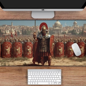 May include: A rectangular mouse mat with an illustration of Roman soldiers. A central officer holds a sword, with a city in the background. The mat's dimensions are 78.7 cm by 39.4 cm. The image includes a keyboard and a computer mouse.