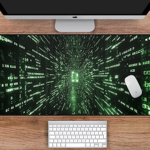 May include: A green and black computer mouse mat with a digital code pattern and a glowing green tunnel in the centre. The mouse mat measures 78.7 cm by 39.4 cm.