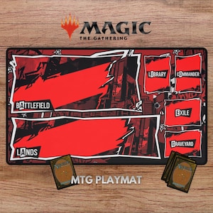 May include: A rectangular Magic: The Gathering playmat featuring a red and black graphic design with designated zones labeled Battlefield, Lands, Library, Commander, Exile, and Graveyard. The mat includes stylized star accents and is displayed with four game cards.