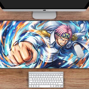 May include: A rectangular mouse pad featuring a dynamic illustration of a character with pink hair, wearing a white coat and blue accents, with a powerful fist. The pad is 31 inches by 15.5 inches.