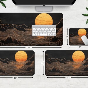 May include: Four different sizes of mouse pads with a black background and a gold line design. The design features a large orange sun and waves. The mouse pads are 31 inches by 15.5 inches, 18 inches by 12 inches, 22 inches by 12 inches, and 9 inches by 7 inches.