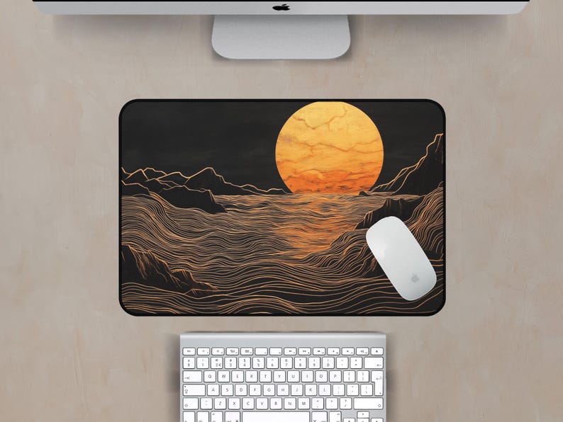 May include: A black and gold mouse pad with a minimalist design of a large orange sun setting over a wavy ocean. The waves are drawn with thin lines.