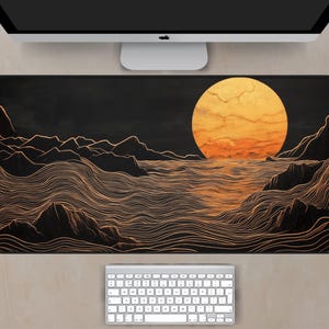 May include: A black and gold abstract design of a sunset over a wavy ocean. The sun is a large, bright orange circle with a red and orange gradient. The waves are represented by thin, gold lines.