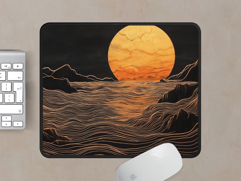 May include: A black and gold mouse pad with a stylized illustration of a large orange sun setting over a wavy ocean. The ocean is depicted with thin, wavy lines.