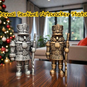 May include: Two decorative nutcracker statues, one silver and one gold, stand side-by-side on a wooden surface. Each statue holds a staff and wears a detailed uniform. The text "Eternal Sentinel Nutcracker Statue" is displayed above the statues.