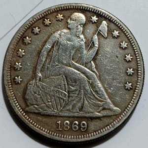 Zittende Liberty Dollar *1869* Verenigde Staten: herslag