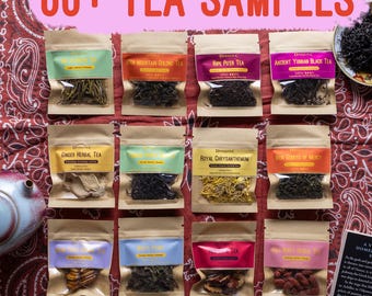 May include: A collection of 60+ tea samples in small, clear, resealable pouches. The pouches are arranged in three rows of four on a red and white patterned surface. Each pouch contains a different type of tea, including black tea, green tea, herbal tea, and pu-erh tea. The pouches are labeled with the type of tea and the brand name "DynaTea".