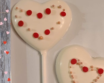 pack of 12 heart-shaped lollipops | dozen of chocolate lollipops | varied designs | party favors