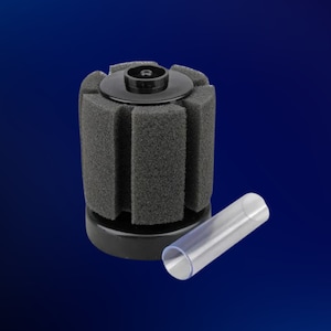 May include: A black aquarium filter with a round, black base and a cylindrical, black foam filter. The filter has a clear plastic tube attached to it.