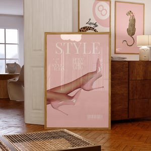 May include: A pink and white magazine cover with the word "STYLE" in large white letters. The cover features a woman's legs in pink high heels. The text on the cover reads "I am a style icon, Holy Holy Chic".