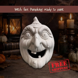 May include: A white, unpainted witch face pumpkin with a large, toothy grin, ready to be painted. The pumpkin has a prominent nose and a textured surface. Text at the top reads "Witch face Pumpking ready to paint".