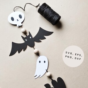 May include: A Halloween garland with black bats, white ghosts, and a skull. The garland is strung with twine and wooden beads. The text "SVG, EPS, PNG, DXF" is written on a white circle.