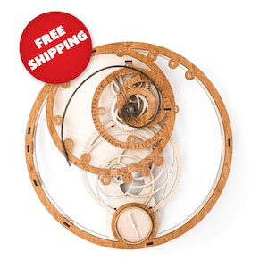 A wooden wall-mounted  DIY working clock puzzle featuring a fibonacci sequence. The puzzle consists of 46 parts and is 13 by 13 by 0.7 inches.