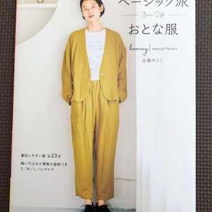 May include: A book titled "Basic Style: Otona Fuku" featuring a model wearing a yellow linen jacket and trousers. The book cover includes the text "hooray! Natural Pattern" and "佐藤ゆうこ".