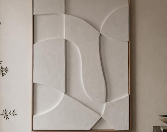 May include: A dining room scene featuring a large, weathered wooden table with matching chairs. A beige vase holds branches, and a framed abstract wall art piece hangs on the wall. A dark wooden cabinet and a hanging lamp complete the room.