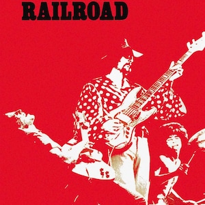 May include: A vintage concert poster for Grand Funk Railroad, a rock band, with a red background and a white silhouette of a musician playing a guitar. The poster includes the band's name, contact information for Premier Talent Associates, Inc., and the personal direction of Terry Knight Enterprises, Ltd.