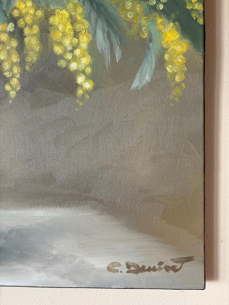 May include: A painting of a bouquet of yellow mimosa flowers in a vase. The flowers are painted in a realistic style with soft brushstrokes. The background is a muted gray.