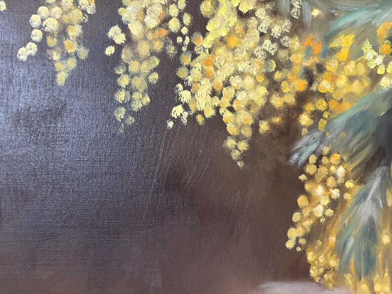 May include: A close-up of a painting featuring a branch of yellow mimosa flowers against a dark brown background.