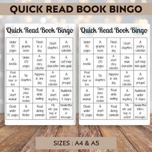 May include: Two Quick Read Book Bingo cards with different bingo squares, such as "Under 150 pages" and "A short memoir." The cards are white with black text and a brown border. The text "Quick Read Book Bingo" is at the top.
