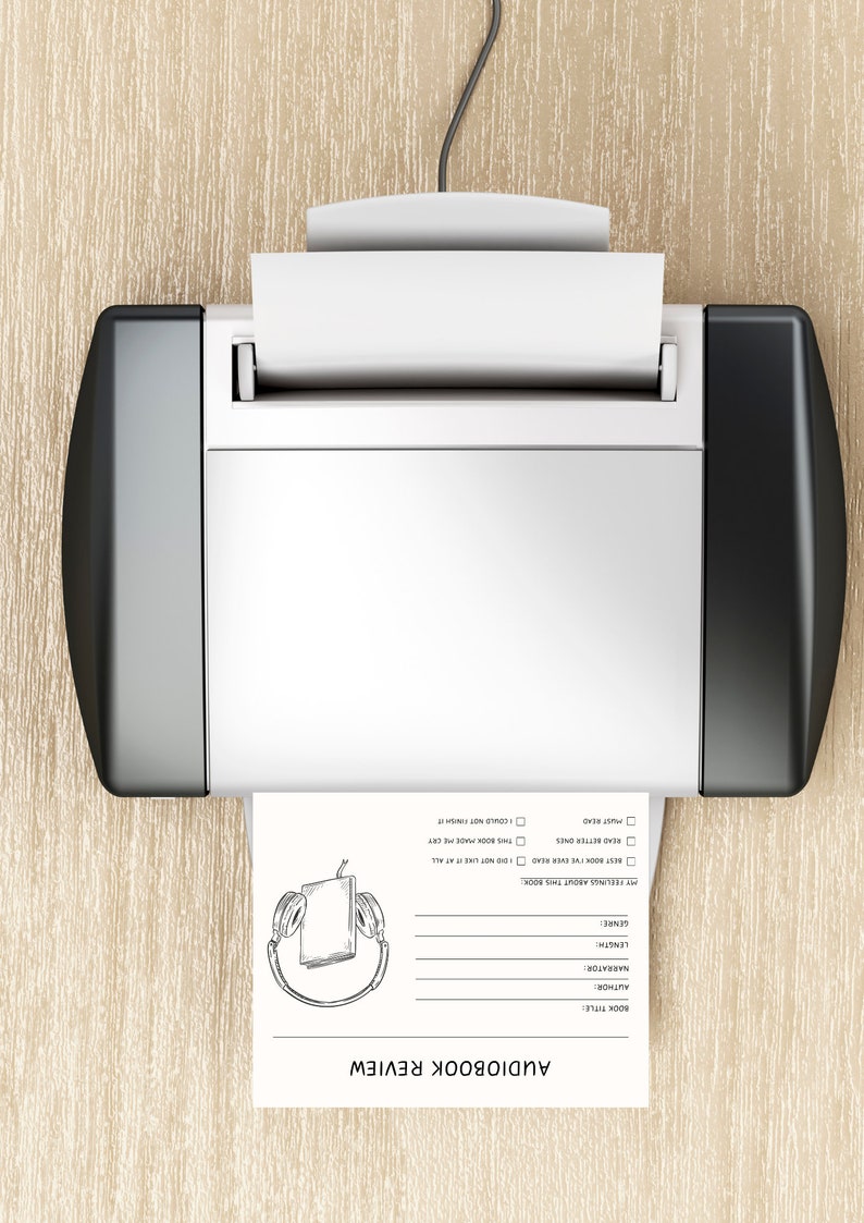 May include: A white sheet of paper with a black and white drawing of headphones and a book is being printed from a black and silver printer. The paper has a title that says "Audiobook Review" and a list of questions to answer about the audiobook.