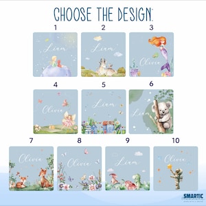 May include: Ten different designs for personalized baby name art prints. Each design features a different illustration, including a fairy, a koala, a mermaid, a fox, a dinosaur, and an astronaut. The designs are all on a light blue background with white stars.