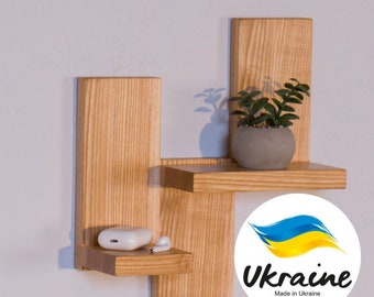 A set of two floating shelves made of natural ash wood. Minimalistic style, minimalist shelves.