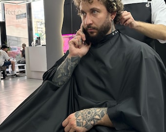 Capa impermeable personalizada para cortar el cabello, larga, negra, para peluquería o salón de belleza, de tela de poliéster.