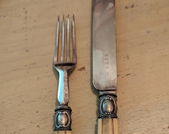 Silver plated and bone handled knife and fork set with bone handles