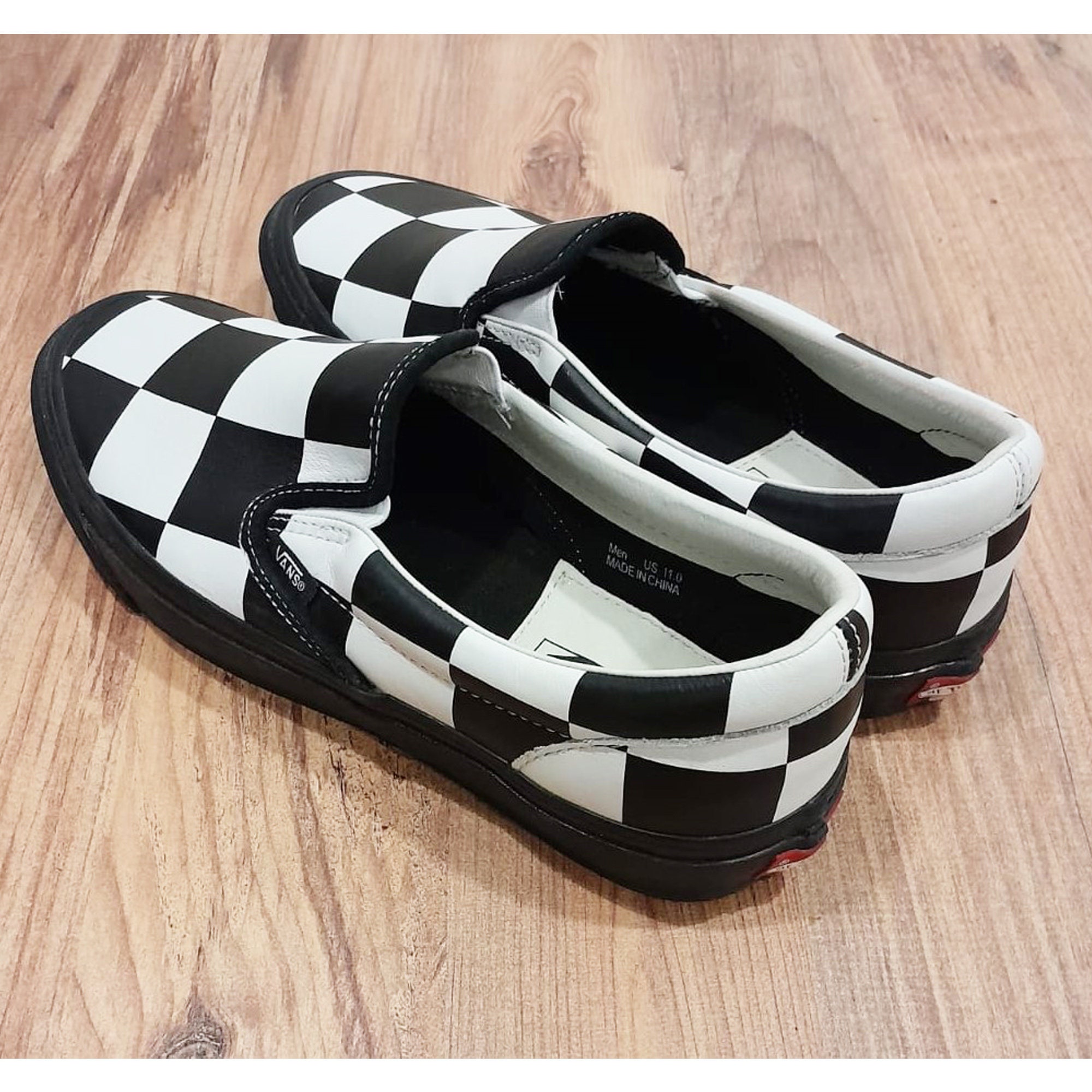 Exclusive Checkerboard Slip-on Sneakers by Vans X Barneys 