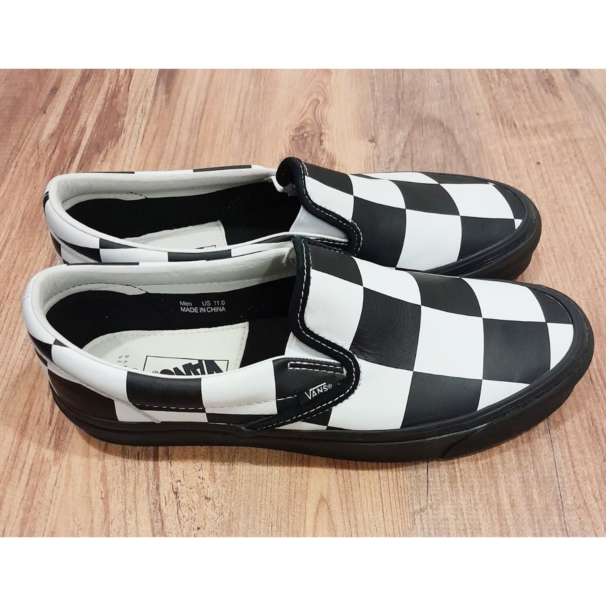Exclusive Checkerboard Slip-on Sneakers by Vans X Barneys 