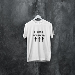 May include: White t-shirt with black text that reads "HYROX WANKER" and four black upward arrows.
