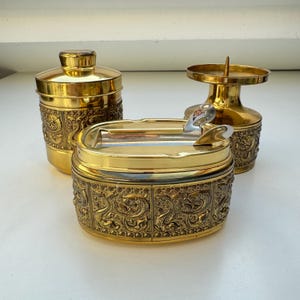 Conjunto vintage de cinzeiro, caixa de cigarros e porta-velas em tom dourado | Estilo meados do século, anos 1970-1980 | Erhard Alemanha