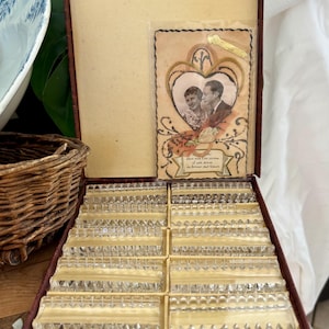 A set of 12 vintage French lead crystal knife rests in original box