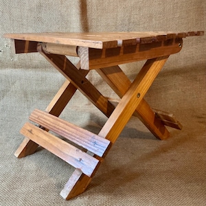 A vintage French foldable stool
