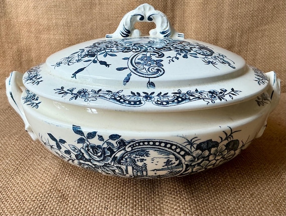 Antique French Salins terre de fer lidded tureen in the Rocaille pattern