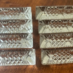 Set of eight vintage French cut crystal knife rests