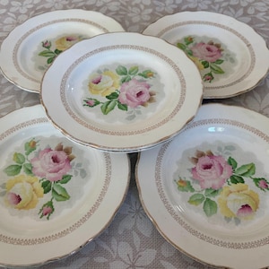 A set of pretty vintage French Gien transferware plates with a floral tapestry design.