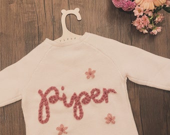 Name Flower Cardigan. Kids Personalised Cardigan With Flower. Childs Name Cardi. Newborn Personalised Knit Cardigan. Baby Announcement Cardi