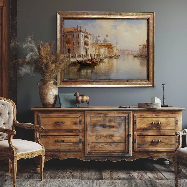 a painting hanging on a wall above a dresser