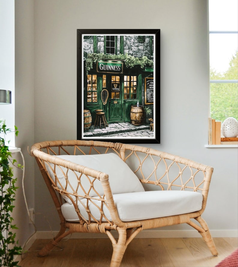a cozy living room with a wicker chair and a framed picture of a pub with a Guinness sign.