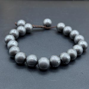 Damascus Steel Bracelet which can be wear as cuff bracelet.
Damascus 12mm bead