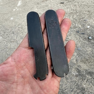 Brass scales for Victorinox 91mm Plus, featuring slots for a toothpick, tweezers, pen, and pushpins