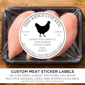 May include: Fresh, raw chicken breasts in a black plastic tray, wrapped in clear plastic. A circular label reads "Free Range Chicken" with a hen silhouette. Text on the label includes "hormone free," "antibiotic free," and farm details. The bottom text says "Custom Meat Sticker Labels."