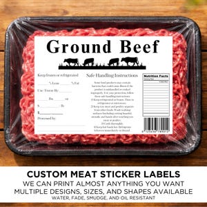 May include: A package of ground beef in a black tray, wrapped in clear plastic. The label reads "Ground Beef" with illustrations of cows. Includes safe handling instructions and nutrition facts. The bottom text says "Custom Meat Sticker Labels".